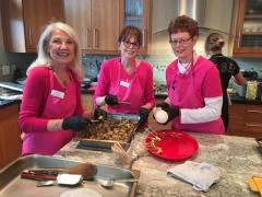 SYNC Volunteers cooking a meal for charity