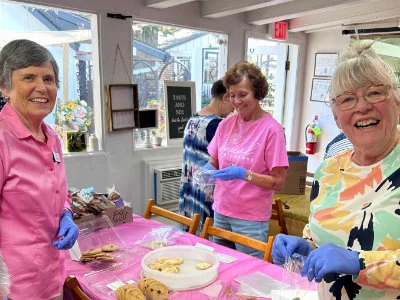 SYNC ladies packaging homemade cookies