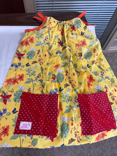 SYNC’s Nifty Needles Group Makes a Big Impact 7 Dress a Girl Dress