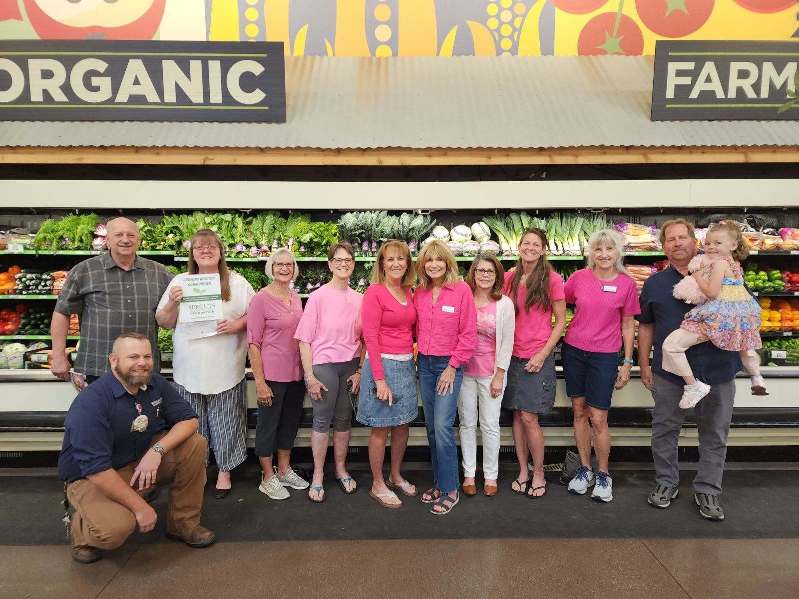 SYNC volunteers helping distribute food with Loaves 'n Fishes