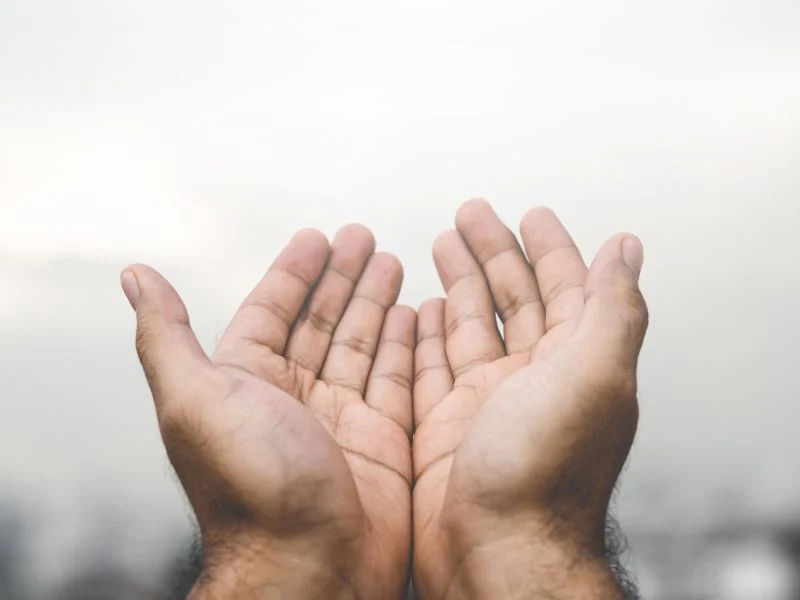 Hands lifted in prayer and praise