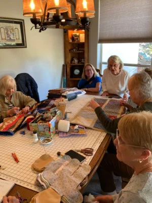 SYNC Nifty Needles Group making a yo-yo quilt