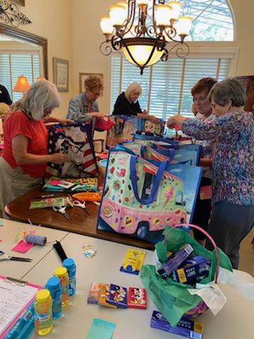 SYNC Ladies filling bags for Awaken Kids