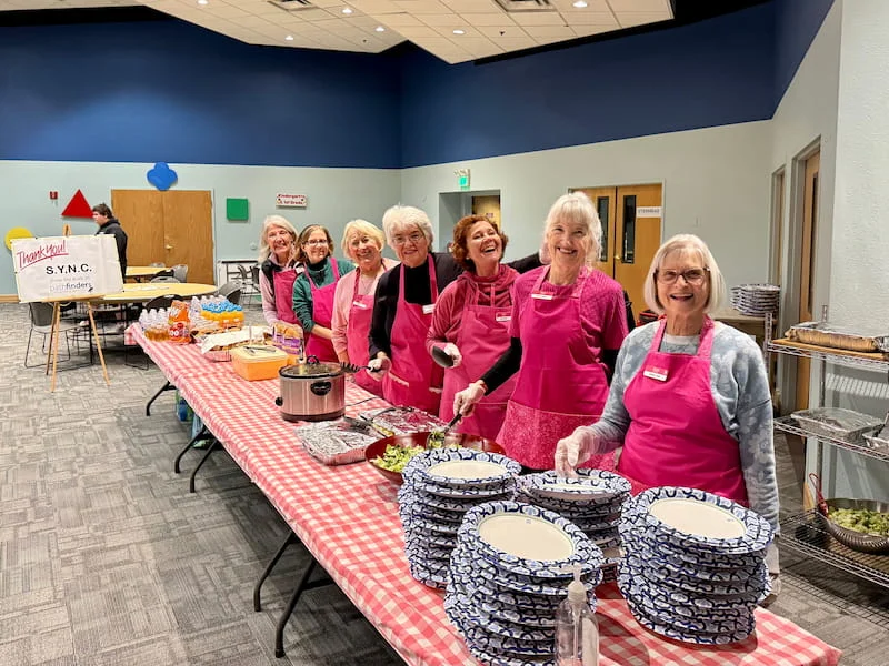 SYNC Ladies serving a homecooked meal to Pathfinders kids and volunteers