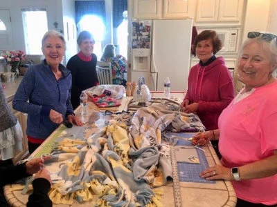 SYNC Volunteers making warm blankets to give to others