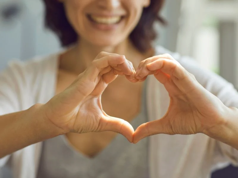 Woman forming a heart with her hands