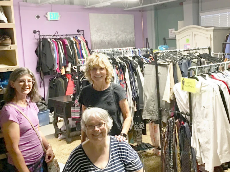 SYNC volunteers serving at a clothes closet